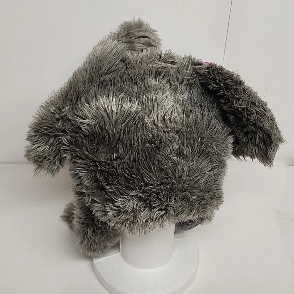 Plush Elephant Hat with Pink Ears, White Tusks, And Adorable Trunk.